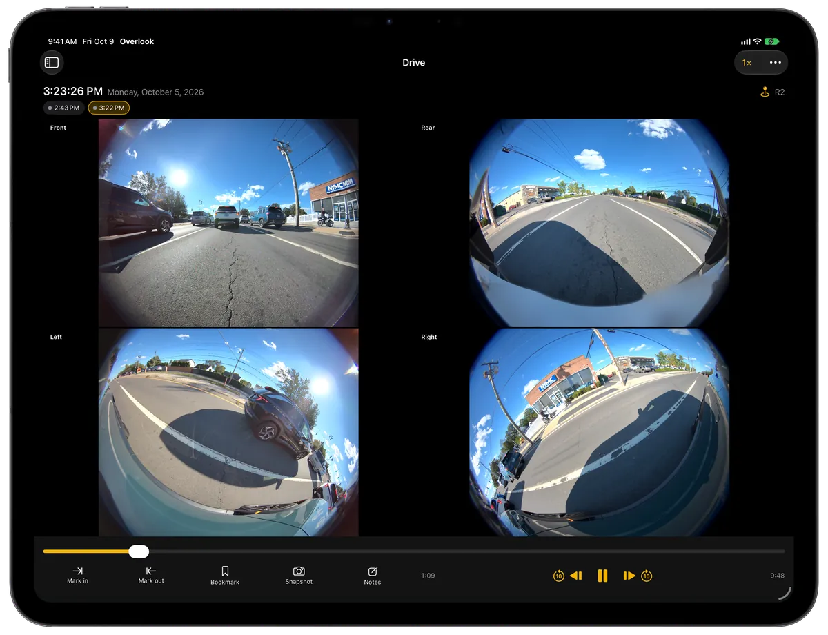 Overlook on iPad in landscape: the front, rear, left and right cameras of a drive playing side by side, with the timeline and playback controls